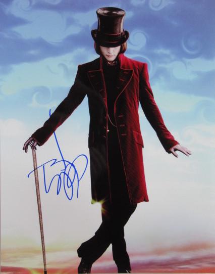 Johnny Depp CHOCOLATE FACTORY In Person Signed Photo: Photo size is 11 x1 4. Johnny Depp in person signed autographed photo from the movie CHARLIE AND THE CHOCOLATE FACTORY. Johnny Depp as the character Willy Wonka.