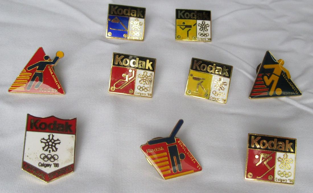 9 Olympic 1988 Kodak Official Pins: A set of 9 Olympic Pins from the Calgary Olympics by Kodak. From 1998 / Seoul Korea