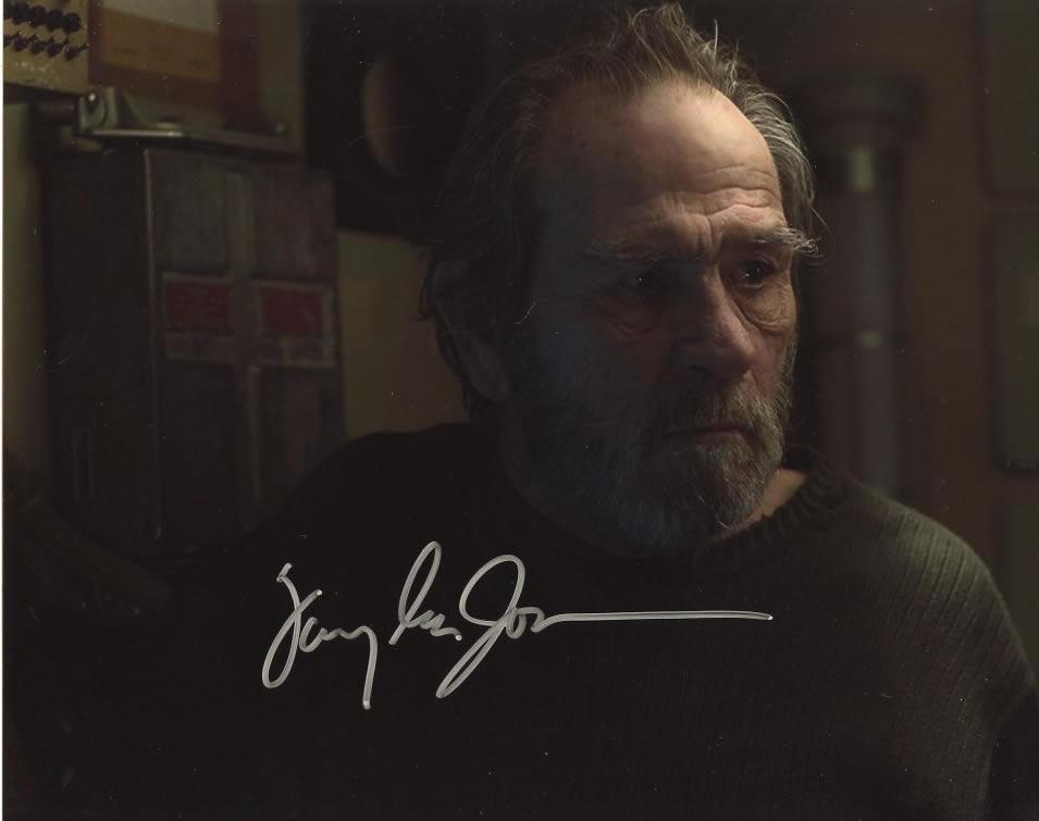 Tommy Lee Jones AD ASTA In Person Signed Photo: Photo size is 8 x 10. Tommy Lee Jones in person signed autographed photo from the movie AD ASTA. Tommy Lee Jones as the character H. Clifford McBride