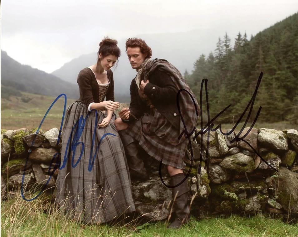 Sam Heughan / Caitriona Balfe OUTLANDER Signed Photo: Sam Heughan / Caitriona Balfe in person signed autographed photo from the TV series OUTLANDER. Sam Heughan as the character Jamie Fraser. Caitriona Balfe as the character Claire Randall