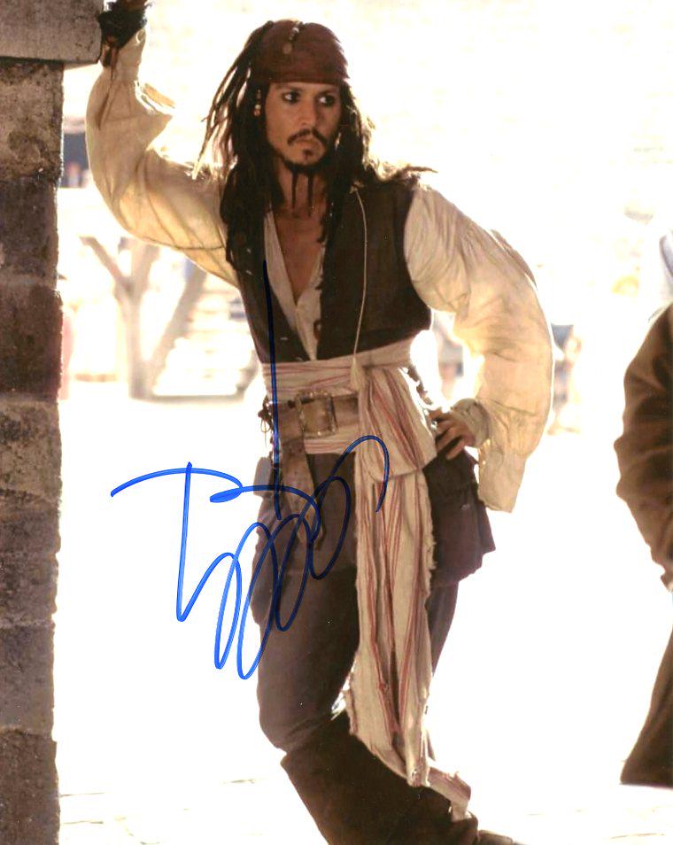 Johnny Depp PIRATES OF THE CARIBBEAN In Person Signed: Johnny Depp in person signed autographed photo from the movie PIRATES OF THE CARIBBEAN. Johnny Depp as the character Jack Sparrow