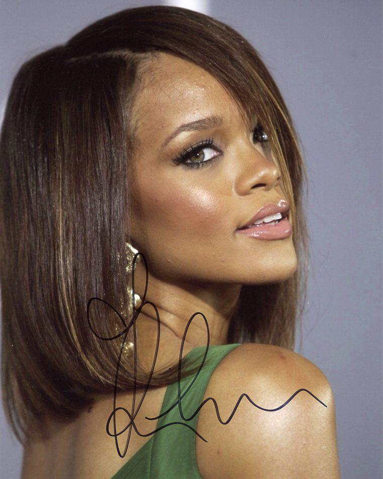 Rihanna MUSICIAN / SEXY In Person Signed Photo: Rihanna in person signed autographed photo. Rihanna Fenty is a Barbadian singer, actress, and businesswoman. Born in Saint Michael and raised in Bridgetown, Barbados, Rihanna was discovered by America