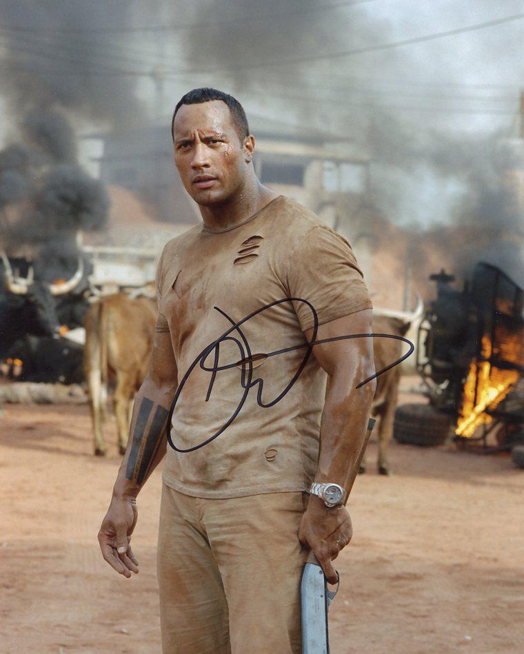Dwayne Johnson THE RUNDOWN In Person Signed Photo: Dwayne Johnson in person signed autographed photo from the movie THE RUNDOWN. Dwayne Johnson as the character Beck