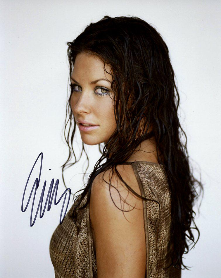 Evangeline Lilly PRETTY In Person Signed Photo: Evangeline Lilly in person signed autographed photo. Evangeline Lilly has done such TV and movies as LOST, ANT-MAN IN THE WASP, and THE HOBBIT Movies.