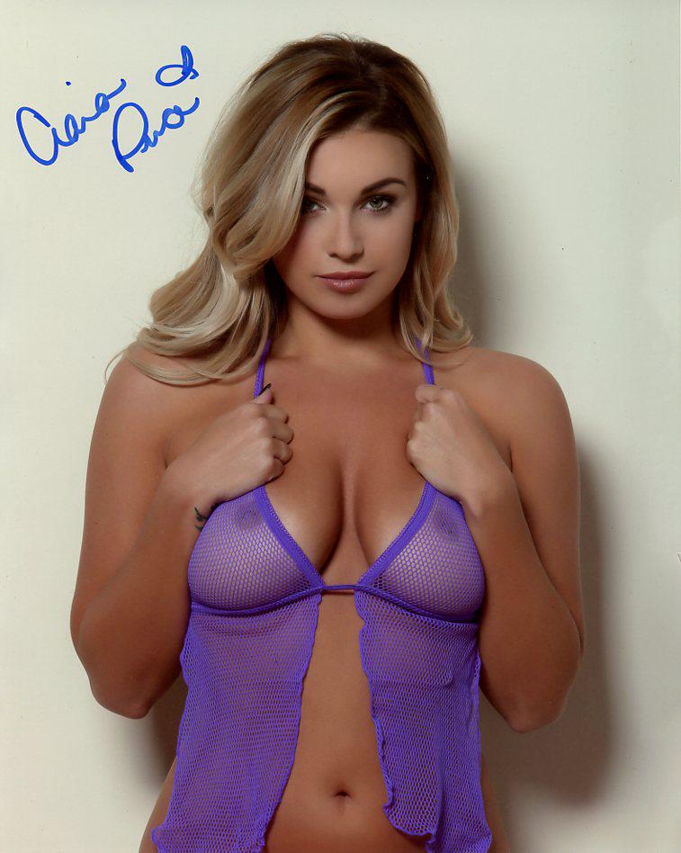Ciara Price PLAYBOY PLAYMATE In Person Signed Photo: ( private signing ) Ciara Price in person signed autographed photo. Ciara Price was the Playboy Playmate of the Month for November 2011. This was from a private signing in photo shoot that was done on