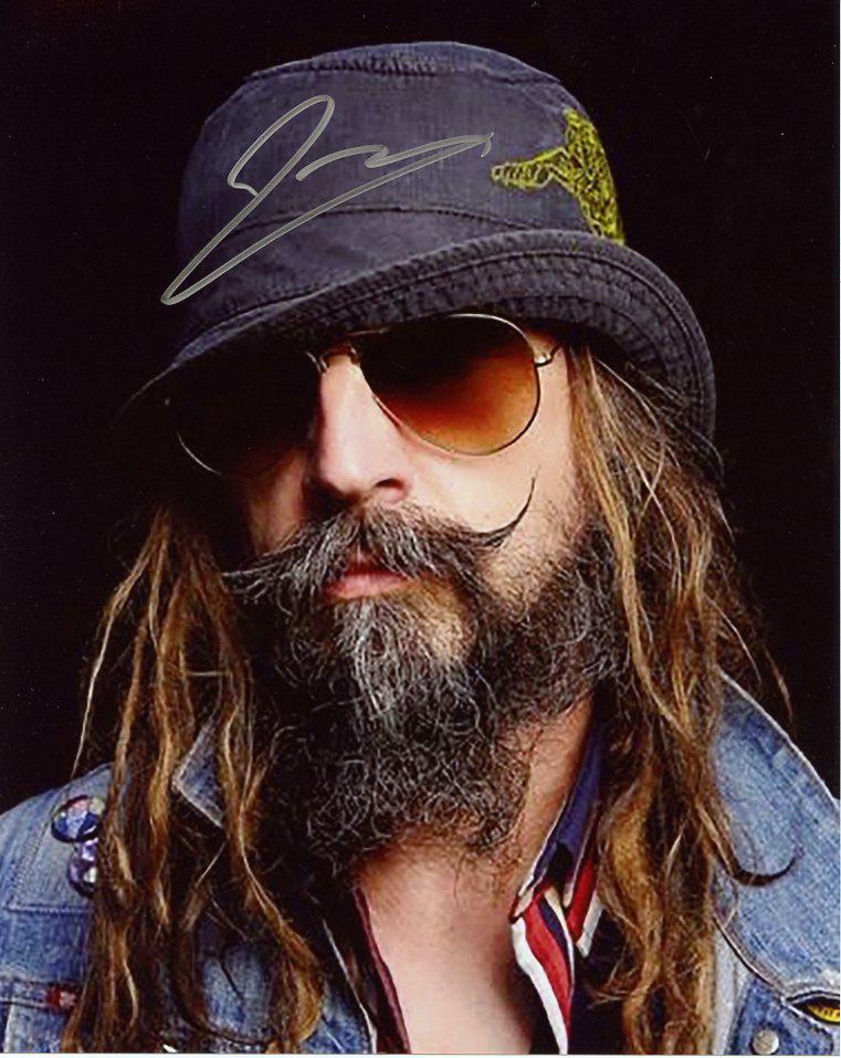 Rob Zombie In Person Signed Photo: Rob Zombie in Person Signed Autographed Photo. Fantastic photo on stage. Director of some great films as HALLOWEEN, THE DEVILS REJECTS, and HOUSE OF 1000 CORPSES