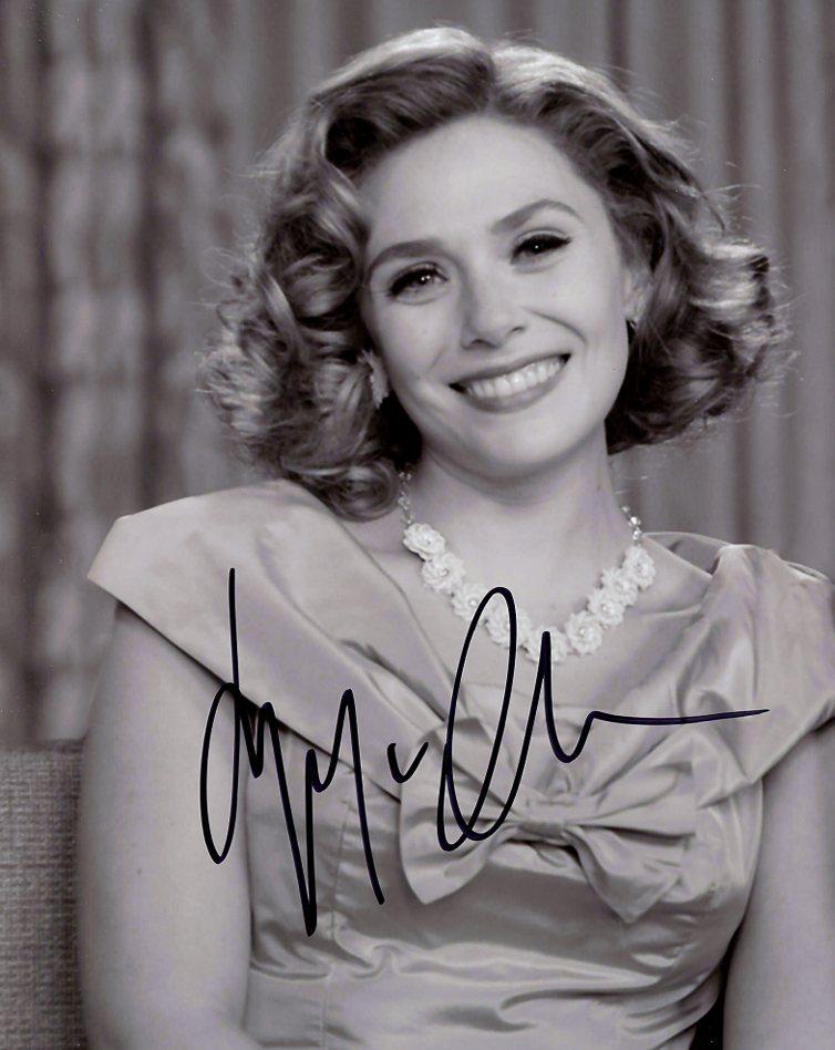 Elizabeth Olsen WANDAVISION In Person Signed Photo: Elizabeth Olsen in person signed autographed photo from the TV series WANDAVISION. Elizabeth Olsen as the character Wanda Maximoff / The Scarlet Witch