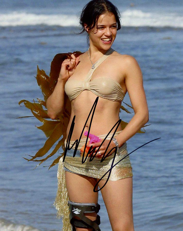 Michelle Rodriguez SEXY In Person Signed Photo: Michelle Rodriguez in person signed autographed photo. Michelle Rodriguez is an American actress. Her breakout role as a troubled boxer in the independent film Girlfight was met with critical acclaim,