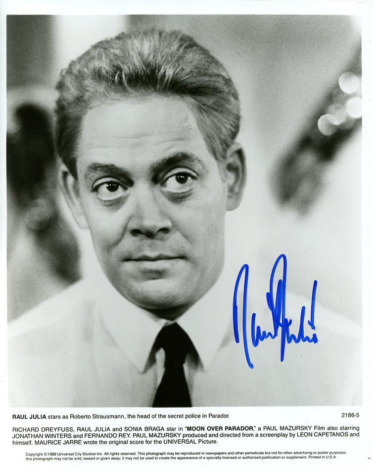 Raul Julia (1940-1994) PARADOR Signed Photo: Raul Julia (1940-1994) signed photo from the movie PARADOR. Raul Julia as the character Roberto Sttrausmann. AMAZING bold signature!