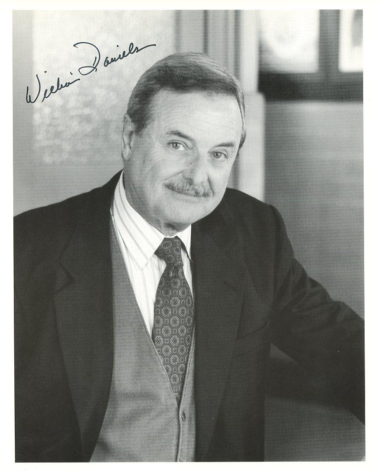 William Daniels ST. ELSEWHERE Signed Photo: William Daniels signed photo. He is best known for his role in ST. ELSEWHERE as Dr. Mark Craig.
