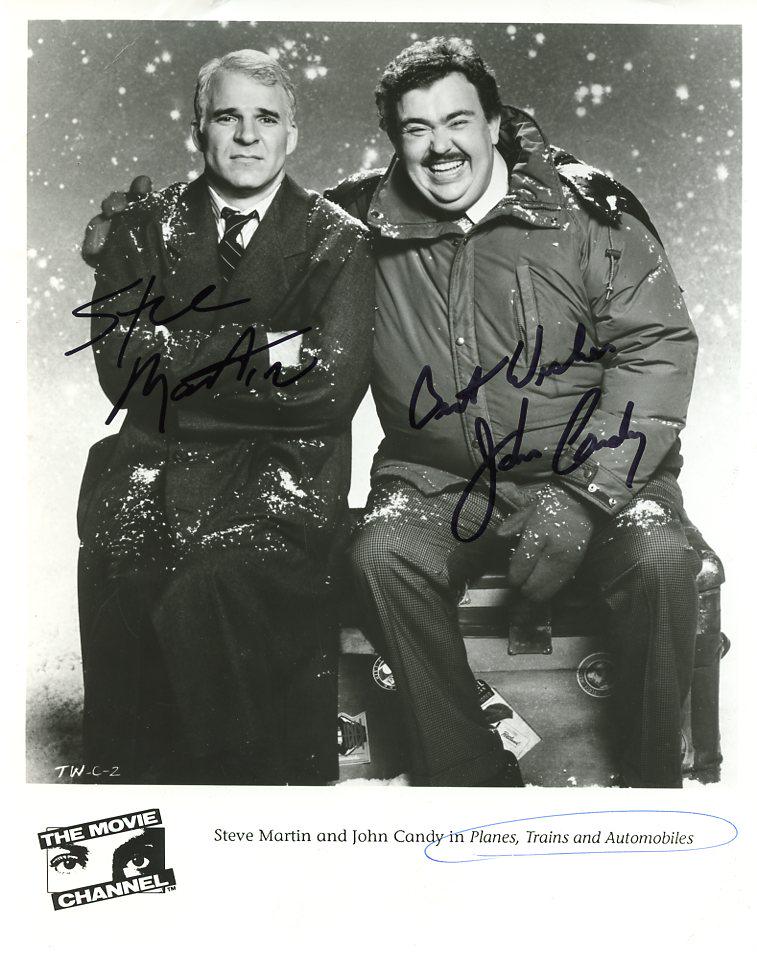 John Candy / Steve Martin PLAINS TRAINS Signed Photo: Photo size is 8x10. AMAZING John Candy / Steve Martin signed photo from the movie PLANES, TRAINS AND AUTOMOBILES. John Candy as the character Del Griffith. Steve Martin as the character Neal Page. PLE