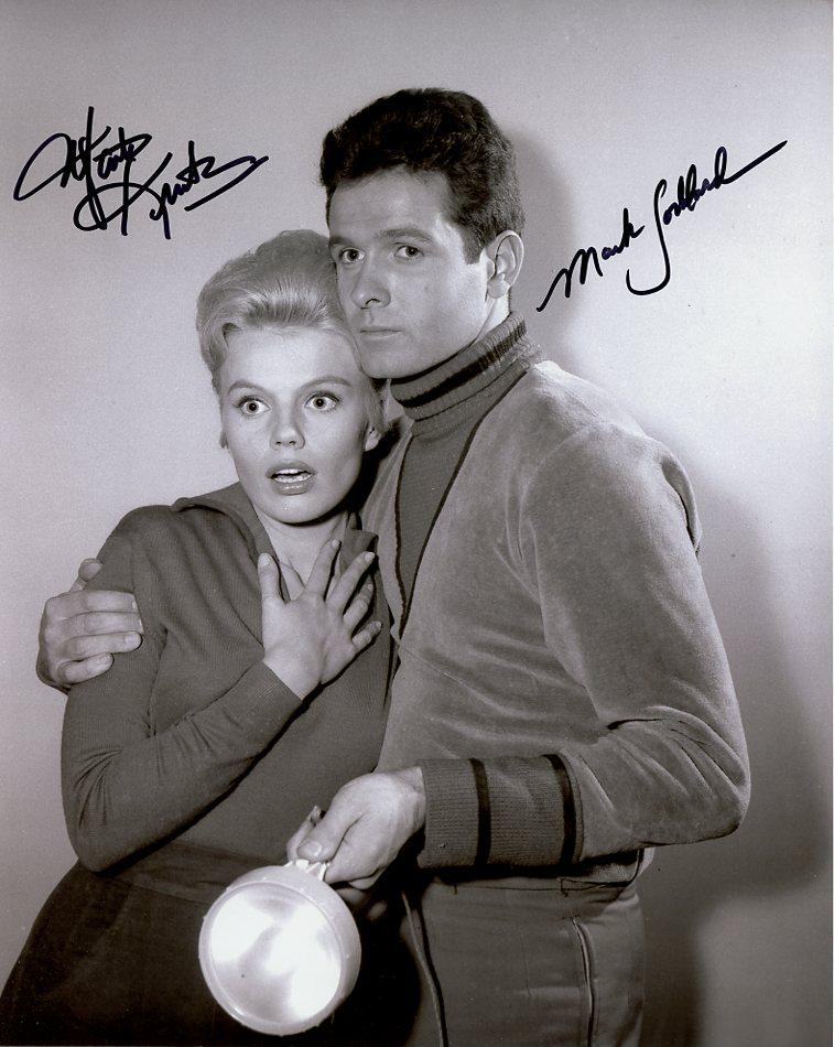 Mark Goddard / Marta Kristin LOST IN SPACE In Person Signed Photo: Photo size is 8 x 10. Mark Goddard / Marta Kristin in person signed photo from the TV series LOST IN SPACE