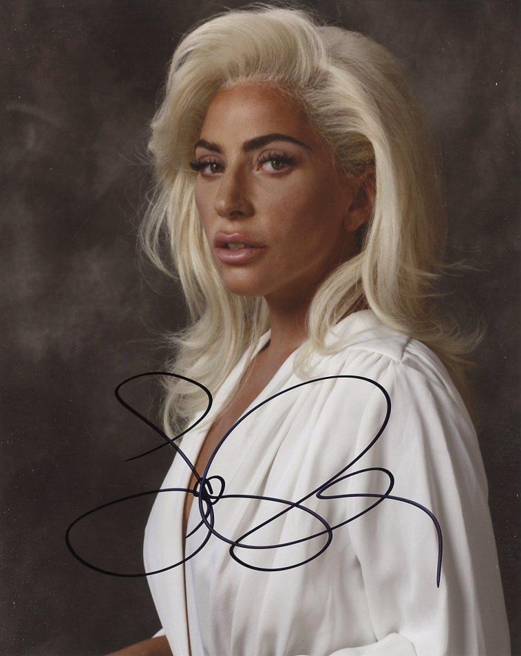 Lady Gaga MUSICIAN In Person Signed Photo: Photo size is 8 x 10. Lady Gaga in person signed autographed photo. Besides being a pop icon superstar Lady Gaga has also been in movies such as A STAR IS BORN BORN, MACHETE KILLS, and SIN CITY