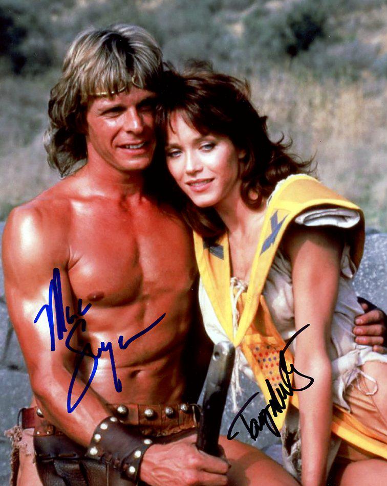 Marc Singer / Tanya Roberts (1949-2021) BEASTMASTER In Person Signed Photo: Photo size is 8.5.x11 Marc Singer / Tanya Roberts (1949-2021) in person signed autographed photo from the movie BEASTMASTER. Marc Singer as the character Dar. Tanya Roberts as the character Kiri.