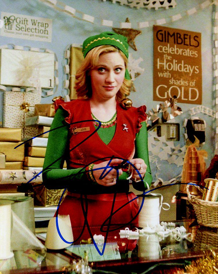 Zooey Deschanel ELF In Person Signed Photo: Photo size is 8x10. Zooey Deschanel in person signed autographed photo from the movie ELF. Zooey Deschanel as the character Jovie. IMPERFECTIONS: slightly grainy image