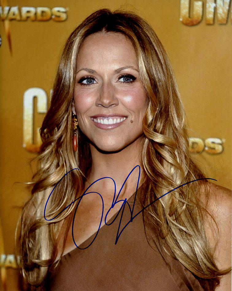 Sheryl Crow MUSICIAN In Person Signed Photo: Photo Size is 8x10. Sheryl Crow beautiful in person signed autographed photo. Sheryl Crow is an American musician, singer, songwriter and actress. Her music incorporates elements of pop, rock, country