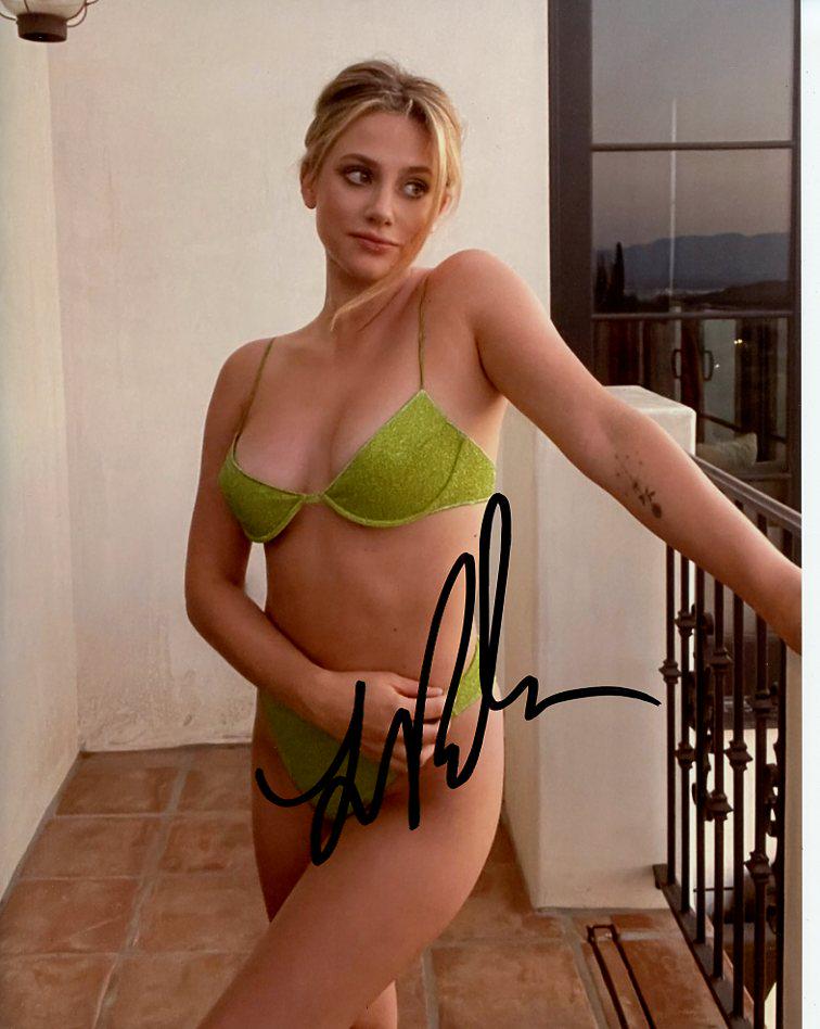 Lily Reinhart RIVERDALE / HUSTLERS In Person Signed Photo: Photo Size is 8x10. Lily Reinhardt in person signed autographed photo. Lily Reinhart is best known for her role as Betty Cooper and TVs RIVERDALE. She has also appeared in CHEMICAL HEARTS and CHARLIE'