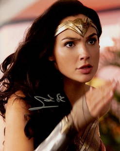 Gal Gadot WONDER WOMAN In Person Signed Photo: Photo size is 8x10. Gal Gadot in person signed autographed photo from the movie WONDER WOMAN. Gal Gadot as the character Diana Prince / Wonder Woman.