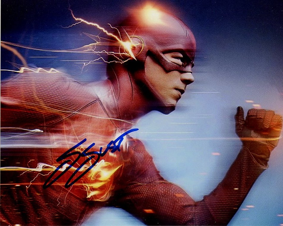 Grant Gustin THE FLASH In Person Signed Photo: Photo size is 8x10. Grant Gustin in person signed autographed photo from the TV series THE FLASH. Grant Gustin as the character Barry Allen / The Flash