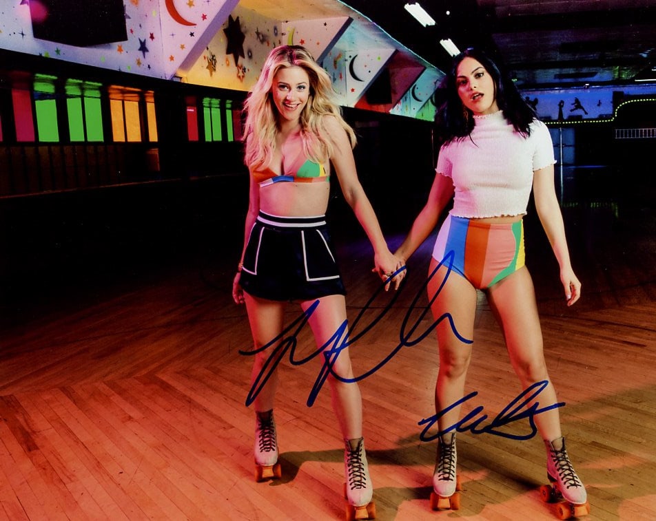 Camila Mendez / Lily Rinehart RIVERDALE In Person Signed Photo: Photo size is 8x10. Camila Mendez / Lily Rinehart in person signed photo from the TV series RIVERDALE. Camila Mendez as the character Veronica Lodge. Lily Rinehart as the character Betty Cooper. Fanta