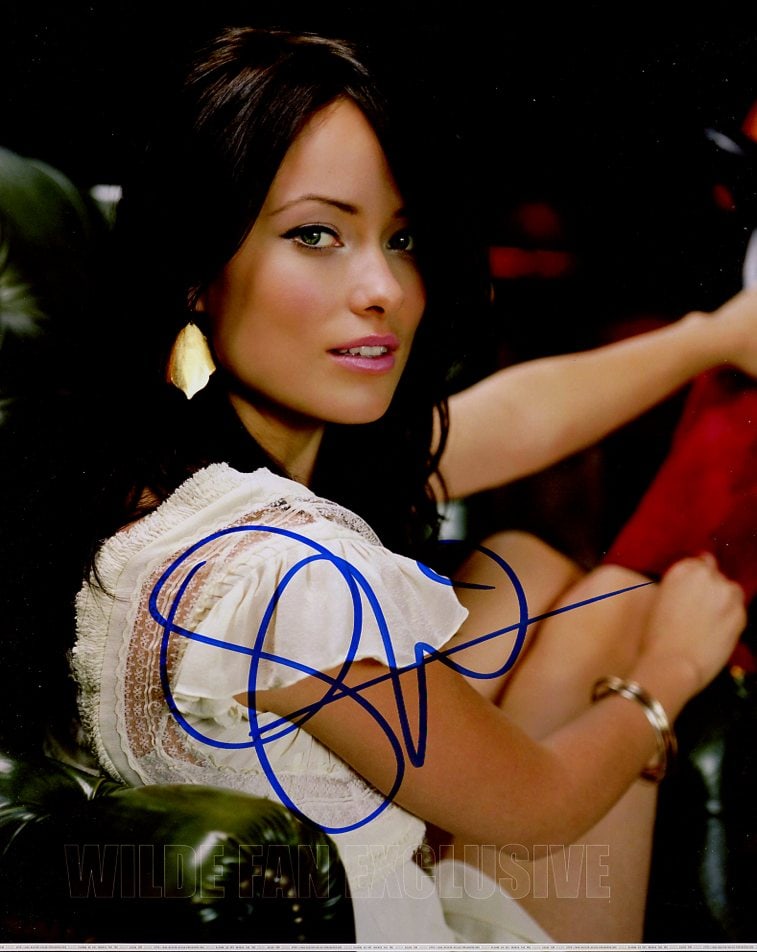 Olivia Wilde TRON / HOUSE MD In Person Signed Photo: Photo size is 8x10. Olivia Wilde in person signed photo. Olivia Wilde has done such TV and movies as TRON, HOUSE MD, and COWBOYS AND ALIENS. IMPERFECTIONS: watermark along bottom of photo.