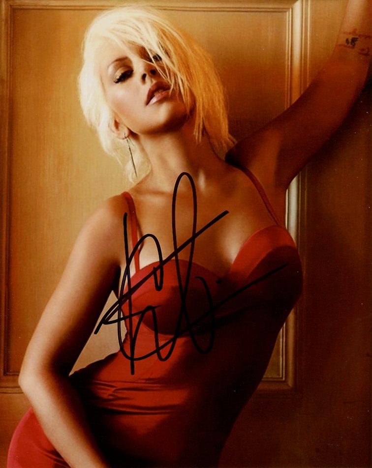 Christina Aguilera SEXY In Person Signed Photo: Photo size is 8x10. Christina Aguilera in person signed photo. Christina Aguilera is an American singer, songwriter, actress, and television personality. Referred to as the "Voice of a Generation", sh