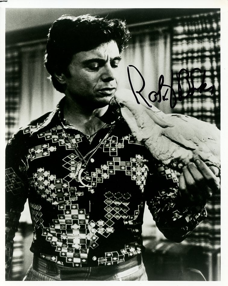 Robert Blake (1933-2023) BARETTA Signed Photo: Photo size is 8x10. Robert Blake (1933-2023) signed photo from the TV series BARETTA. Robert Blake as the character Detective Tony Baretta.
