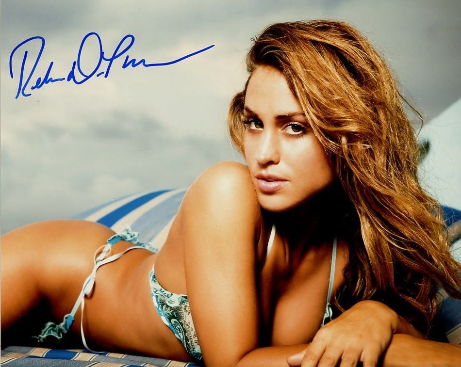 Rebecca DiPietro PLAYBOY / WWE In Person Signed Photo: Photo size is 8x10. Rebecca DiPietro in person signed photo. Rebecca DiPietro is a Playboy Model, former professional wrestling valet and retired professional wrestler who is best known for her time a
