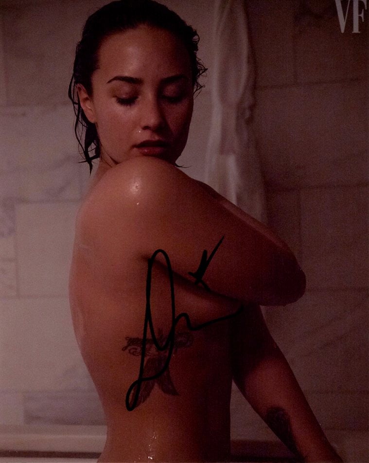 Demi Lovato CAMP ROCK / GORGEOUS In Person Signed Photo: Photo size is 8x10. Demi Lovato in person signed autographed photo. Demi Lovato is an American singer, songwriter, and actress. After appearing on the children's television series Barney & Friends, Lo