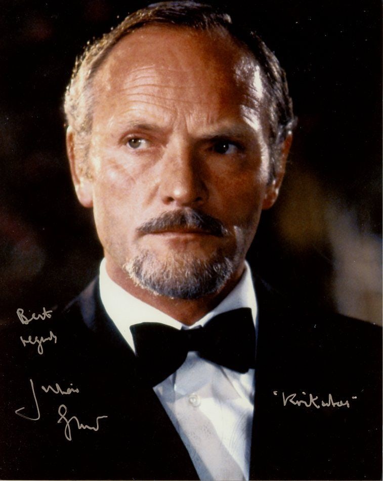 Julian Glover (James Bond) FOR YOUR EYES ONLY In Person Signed Photo: Photo size is 8x10. Julian Glover in person signed photo from the James Bond movie FOR YOUR EYES ONLY. Julian Glover as the character Kristatos. He is also added his character name.
