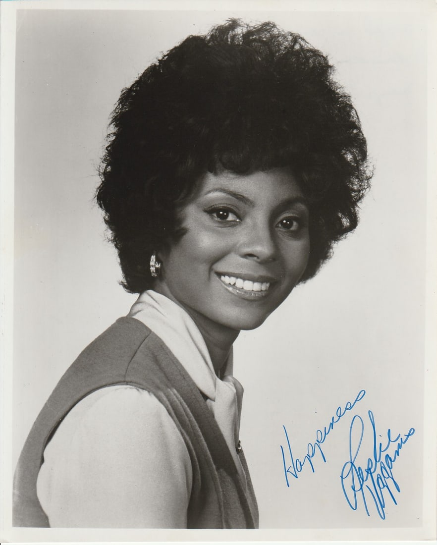 Leslie Uggams DEADPOOL / AMERICAN FICTION In Person Signed Photo: Photo size is 8x10. Leslie Uggams in person signed photo. Leslie Uggams is an American actress and singer. Beginning her career as a child in the early 1950s, Uggams is recognized for portraying Kizzy