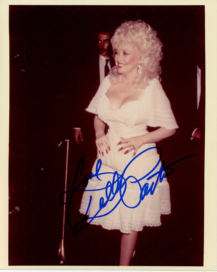 Dolly Parton COUNTRY LEGEND In Person Signed Photo: Photo size is 8x10. TOUGH SIGNATURE Dolly Parton in person signed photo. Country music singer, actress and Oscar nominated songwriter. She starred in the film "9 to 5