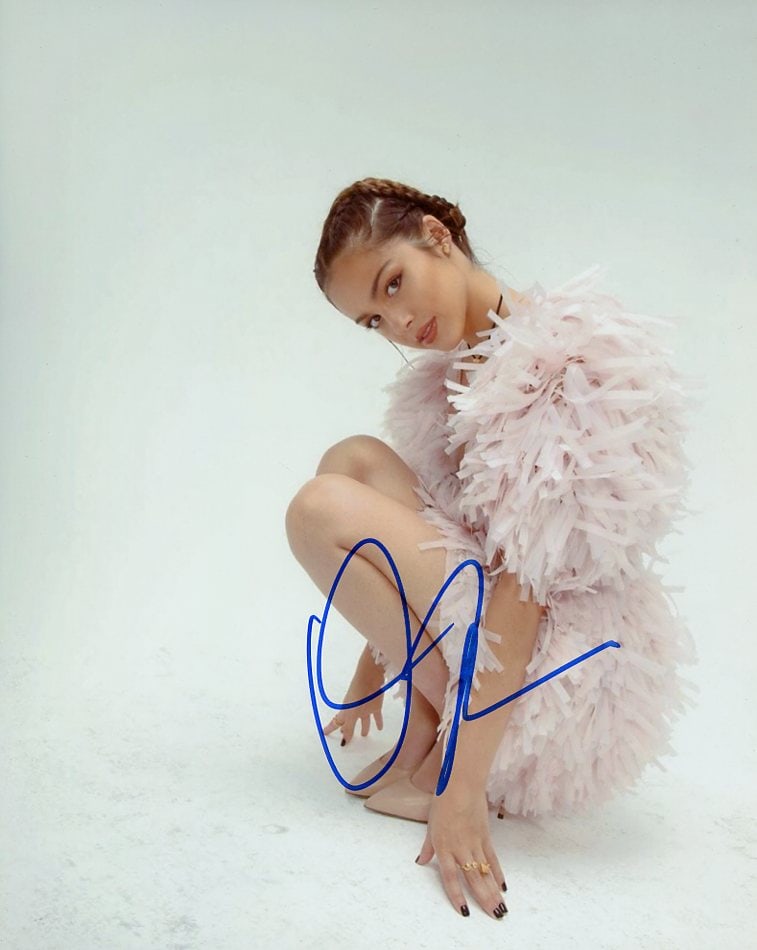 Olivia Roderigo SINGER / SEXY In Person Signeded Photo: Photo size is 8x10. Olivia Roderigo in person Signeded photo. Olivia Roderigo is an American singer-songwriter and actress. She first rose to prominence for starring on the Disney Channel series Bizaa