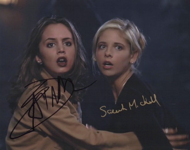 Sarah Michelle Geller / Eliza Dushku BUFFY In Person Signed Photo: Photo size is 8x10. Sarah Michelle Geller / Eliza Dushku in person signed photo from the TV series BUFFY THE VAMPIRE SLAYER. Sarah Michelle Geller as the character Buffy Summers. Eliza Dushku as the c