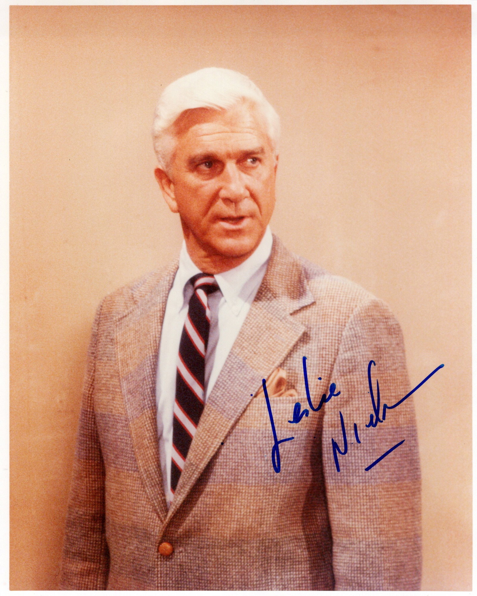 Leslie Nielsen (1926-2010) NAKED GUN In Person Signed Photo: Photo size is 8x10. Leslie Nielsen (1926-2010) in person signed photo from the movie NAKED GUN. Leslie Nielsen as the character Lieut. Frank Drebin.