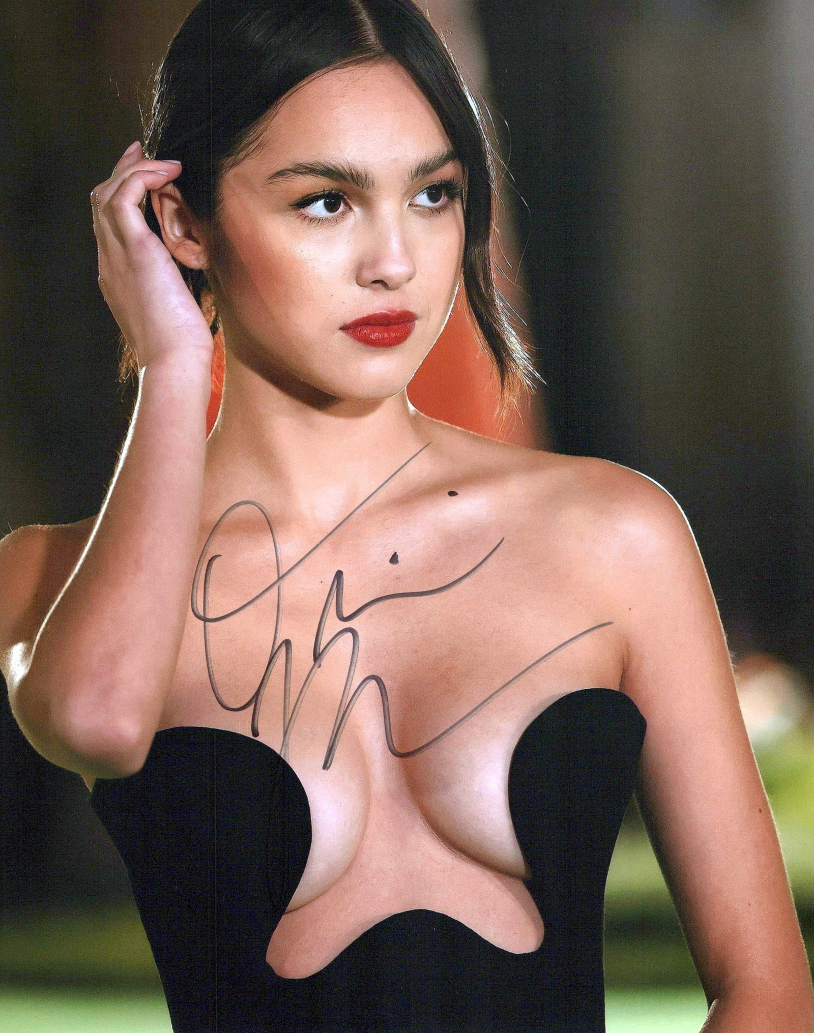 Olivia Roderigo SINGER In Person Signed Photo: Photo size is 8x10. Olivia Roderigo in person signed photo. Olivia Roderigo is an American singer-songwriter and actress. She first rose to prominence for starring on the Disney Channel series Bizaard