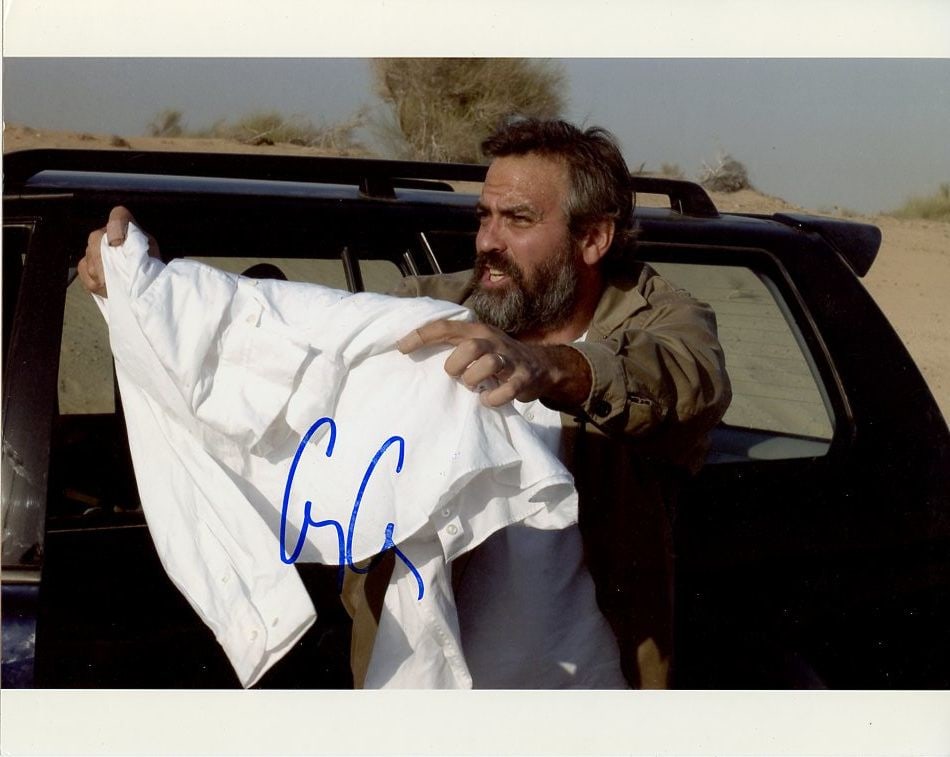 George Clooney SYRIANA In Person Signed Photo: Photo size is 8x10. George Clooney in person signed photo from the movie SYRIANA. George Clooney as the character Bob Barnes