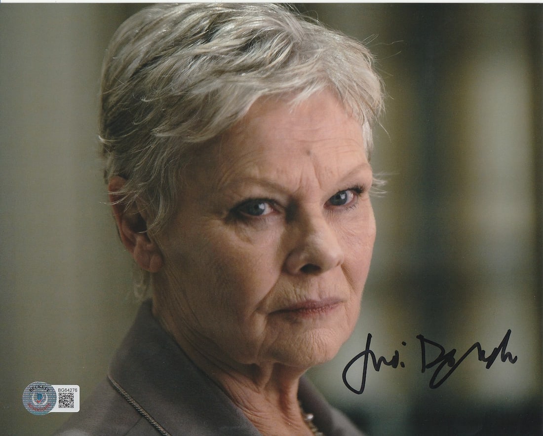 Judi Dench QUANTUM OF SOLACE In Person Signed Photo: Photo size is 8x10. Judi Dench in person signed photo from the James Bond movie QUANTUM OF SOLACE. Judi Dench as the character M.