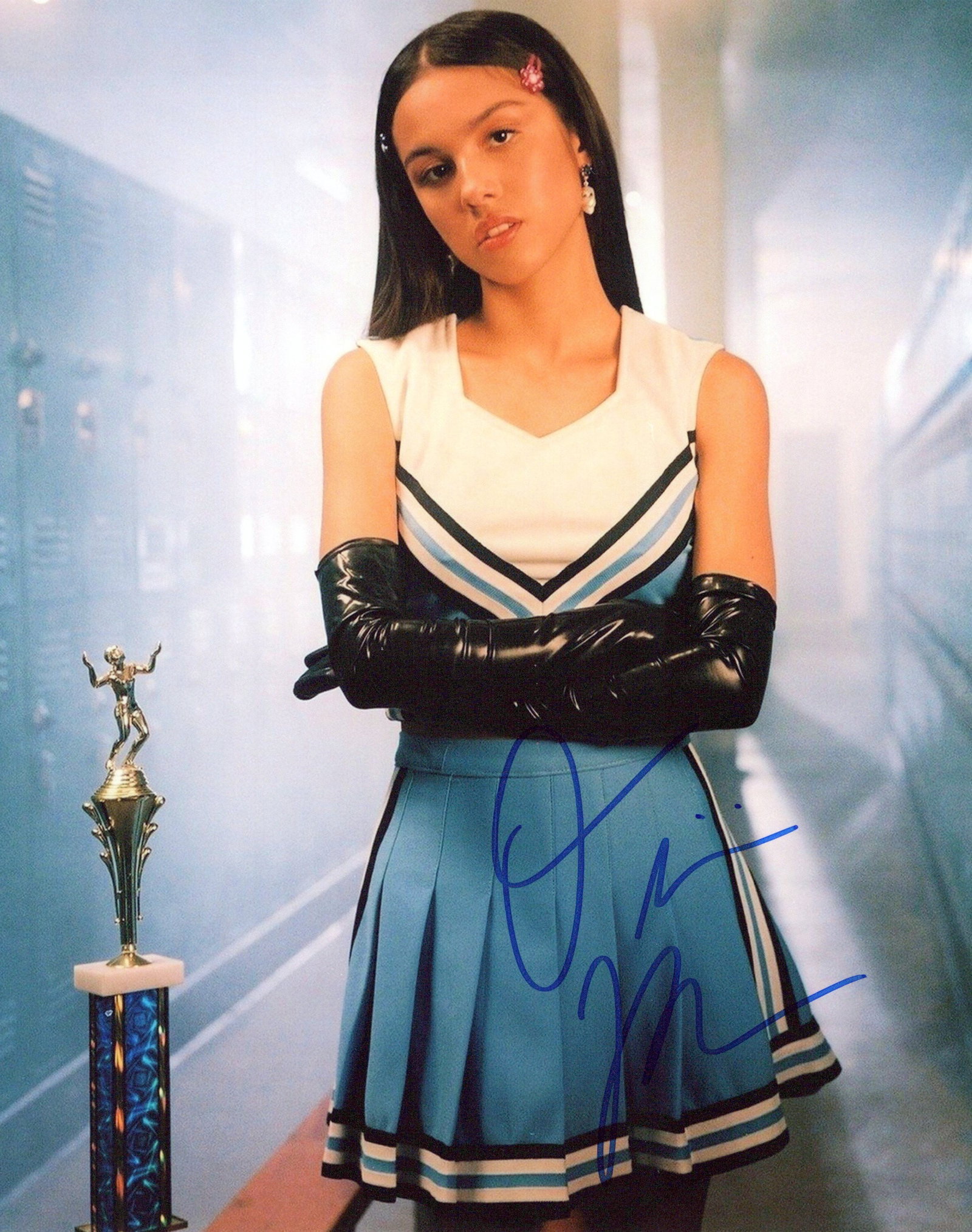 Olivia Roderigo SINGER In Person Signeded Photo: Photo size is 8x10. Olivia Roderigo in person Signeded photo. Olivia Roderigo is an American singer-songwriter and actress. She first rose to prominence for starring on the Disney Channel series Bizaa