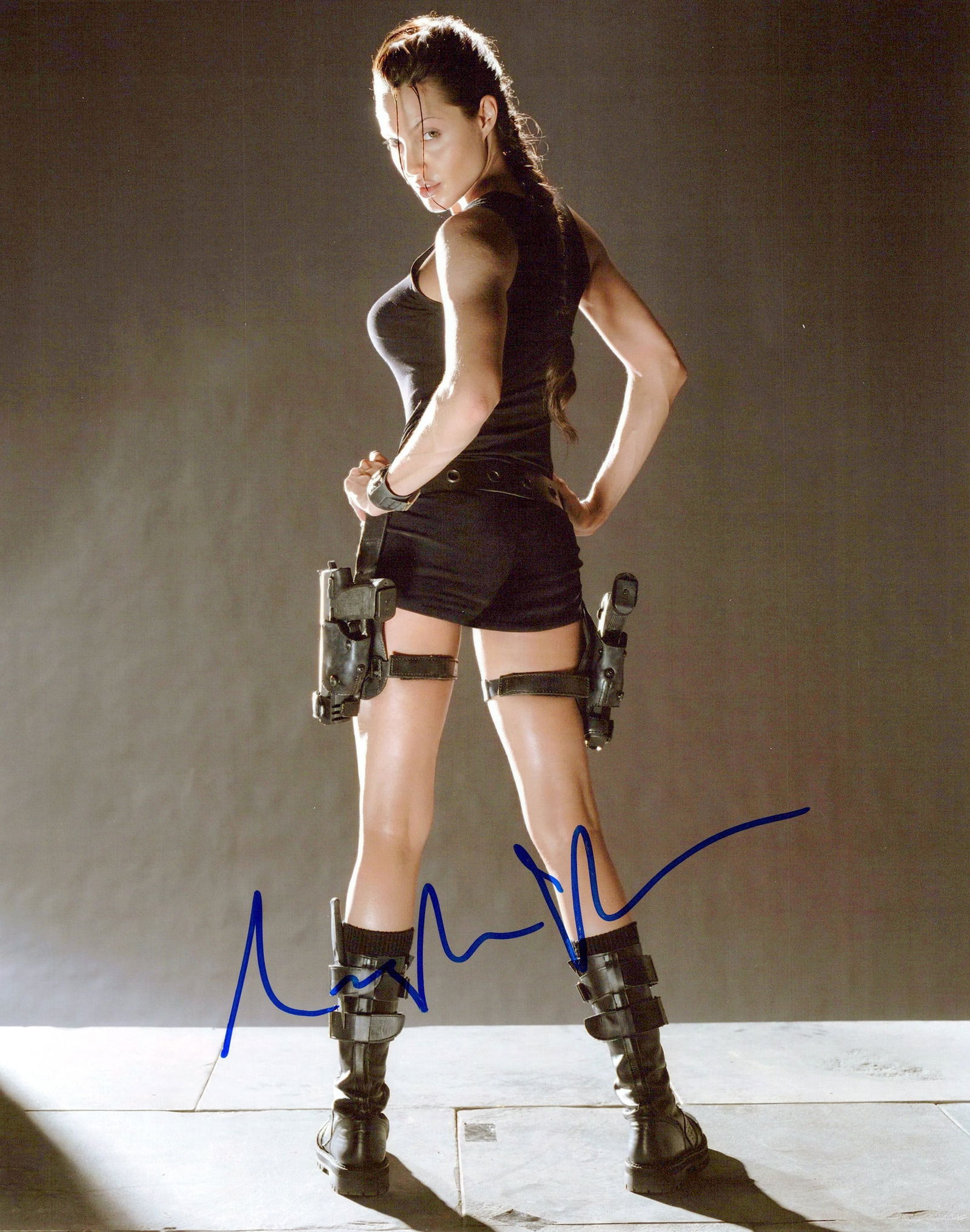 Angelina Jolie TOMB RAIDER In Person Signed Photo: Photo size is 8x10. Angelina Jolie in person signed photo from the movie TOMB RAIDER. Angelina Jolie as the character Lara Croft.