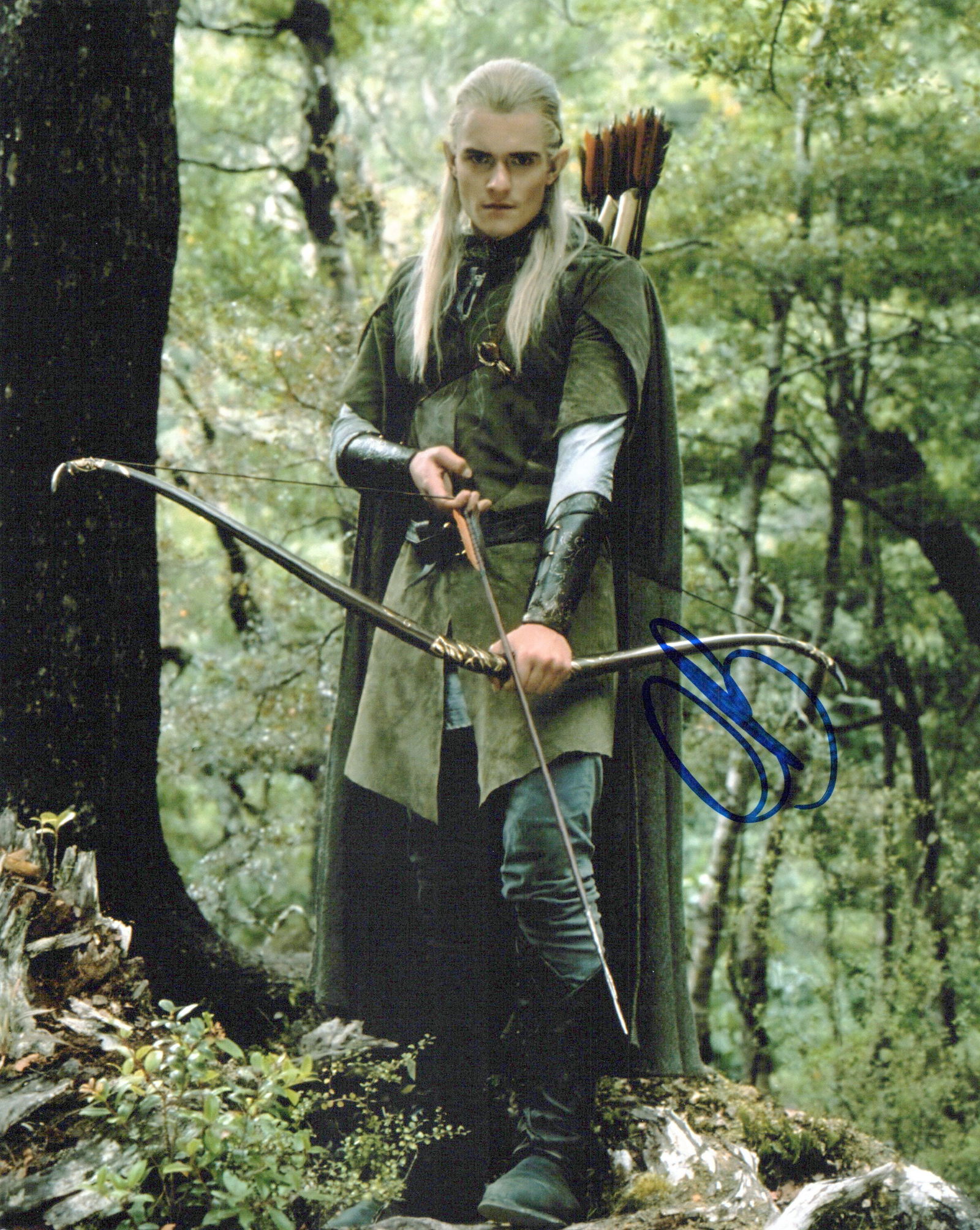 Orlando Bloom LOTR In Person Signed Photo: Photo size is 8x10. Orlando Bloom in person signed autographed photo from the movie LORD OF THE RINGS. Orlando Bloom as the character Legolas