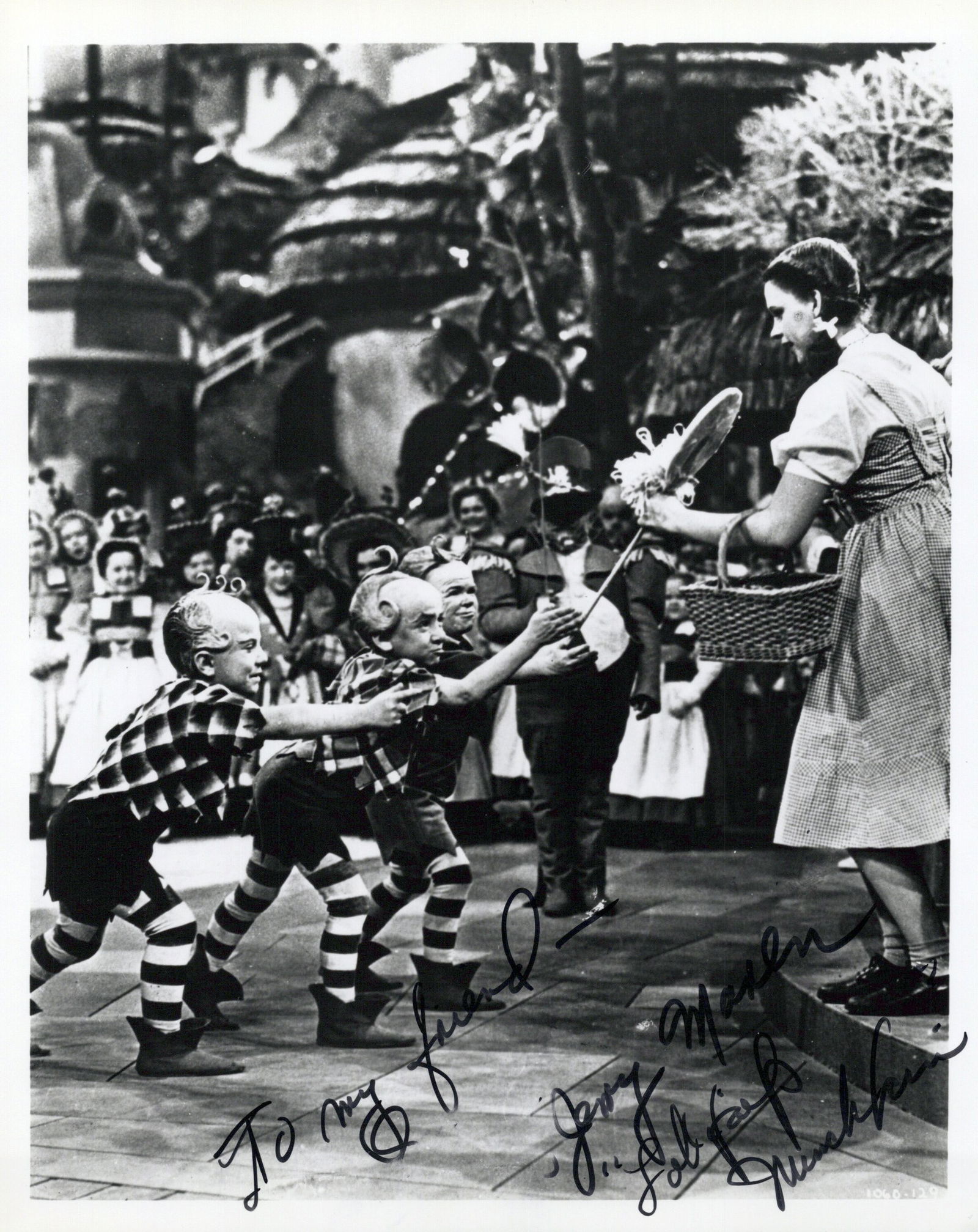 Jerry Maren (1920-2018) WIZARD OF OZ In Person Signed Photo: Photo size is 8x10. Jerry Maren (1920-2018) in person signed photo from the movie THE WIZARD OF OZ. Jerry Maren as the character Lollipop Guild Member.