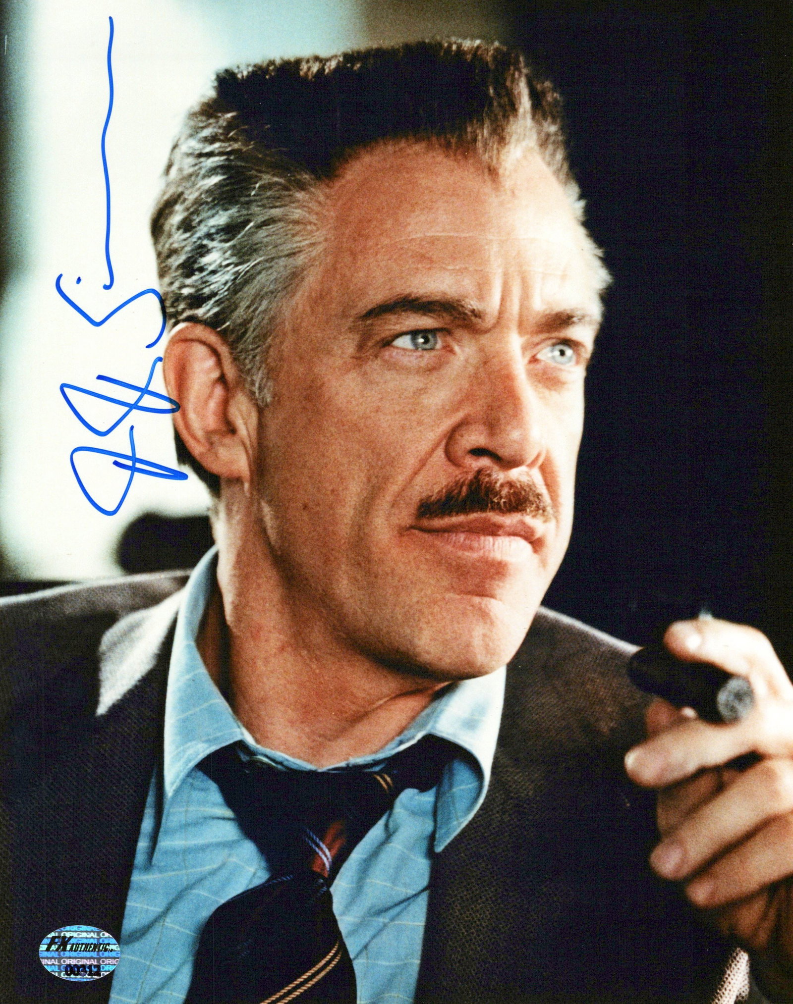 JK Simmons SPIDER-MAN In Person Signed Photo: Photo size is 8x10. JK Simmons in person signed photo from the movie SPIDER-MAN. JK Simmons as the character J Jonah Jamseson.