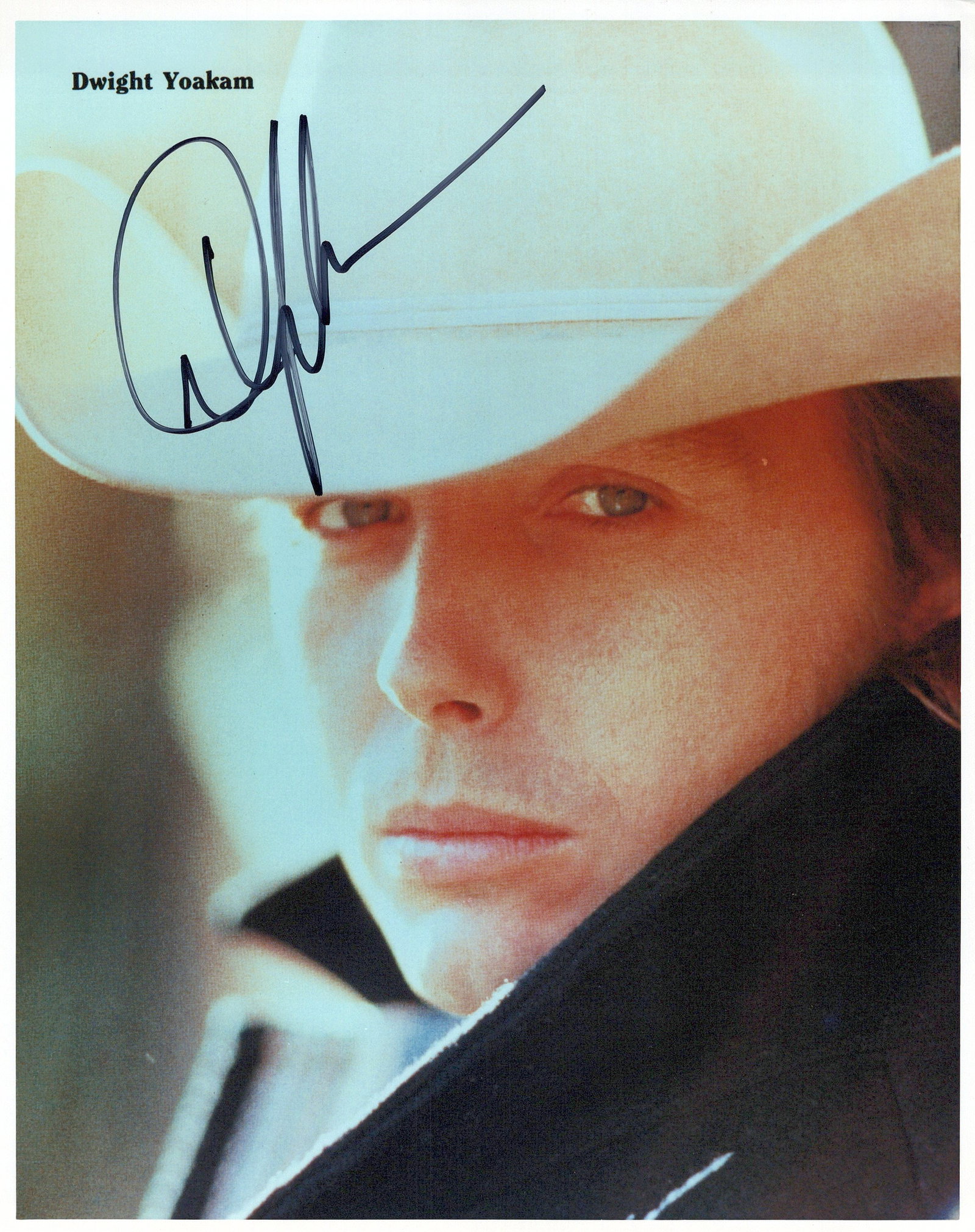 Dwight Yoakam COUNTRY In Person Signed Photo: Photo size is 8x10. Dwight Yoakam in person signed photo. Dwight Yoakam is an American singer, songwriter, actor, and filmmaker who rose to fame in the 1980s. His musical style blends honky-tonk, Bake