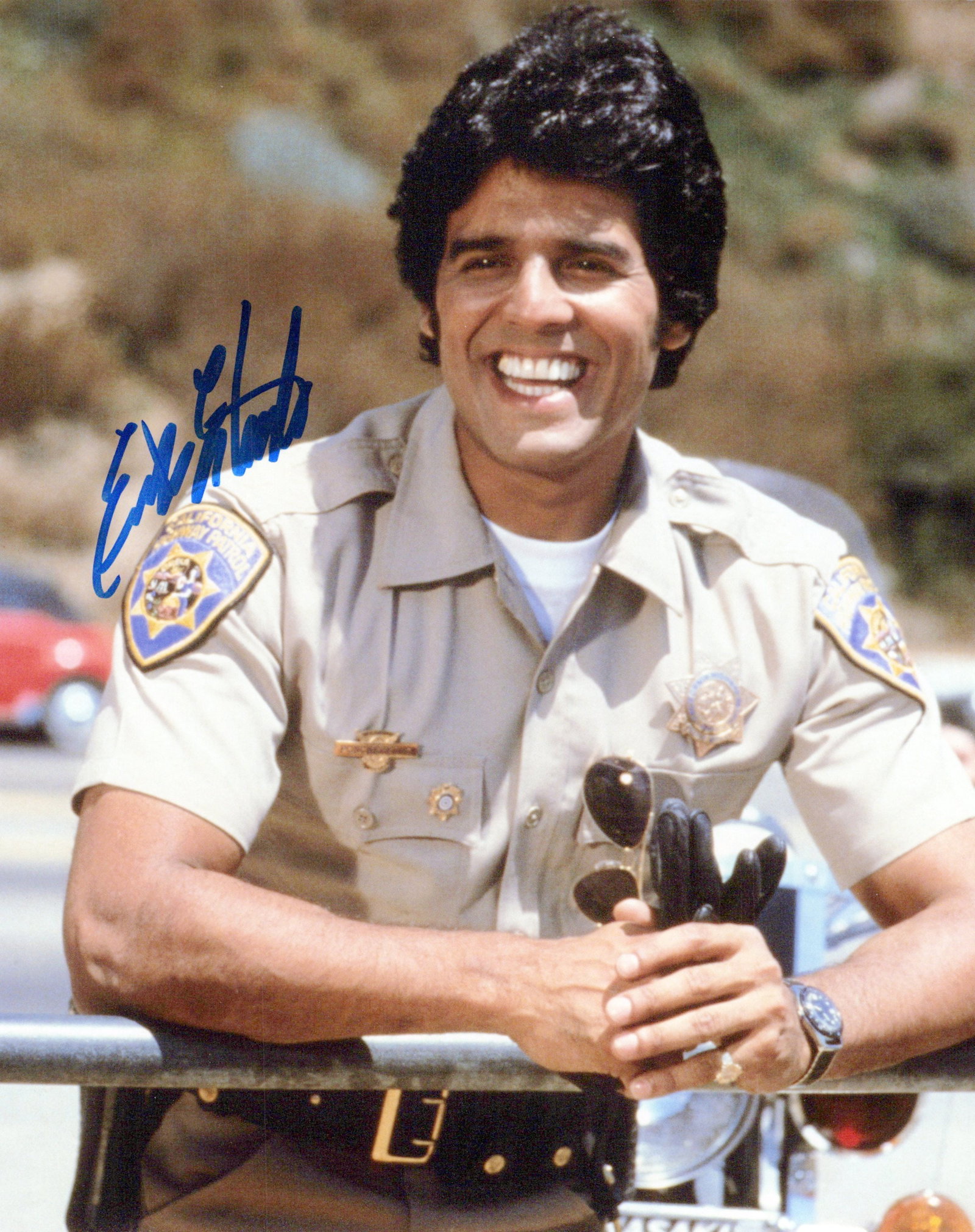 Erik Estrada CHIPS In Person Signed Photo: Photo size is 8x10. PRIVATE SIGNING. Erik Estrada in person signed photo from the TV series CHIPS. Erik Estrada as the character Officer Frank Poncherello