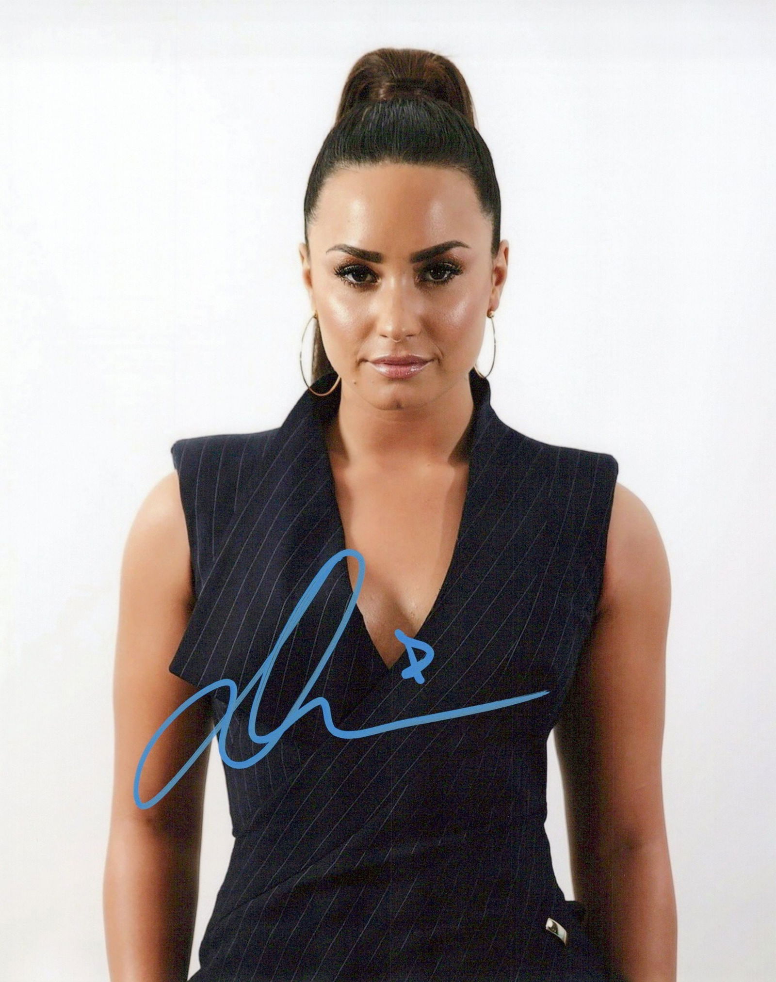 Demi Lovato SINGER In Person Signed Photo: Photo size is 8x10. Demi Lovato in person signed autographed photo. Demi Lovato is an American singer, songwriter, and actress. After appearing on the children's television series Barney & Friends, Lo