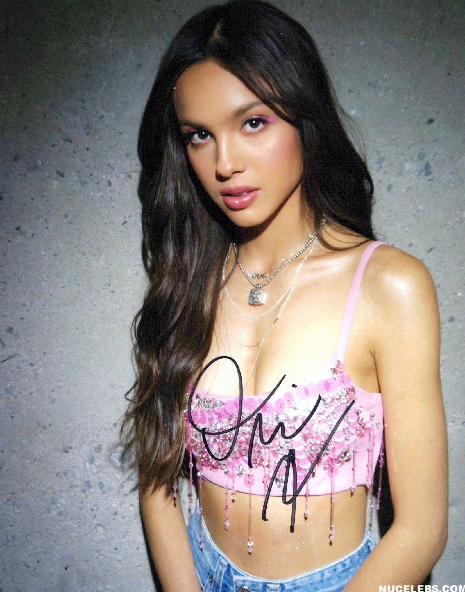 Olivia Roderigo SINGER In Person Signeded Photo: Photo size is 8x10. Olivia Roderigo in person Signeded photo. Olivia Roderigo is an American singer-songwriter and actress. She first rose to prominence for starring on the Disney Channel series Bizaa