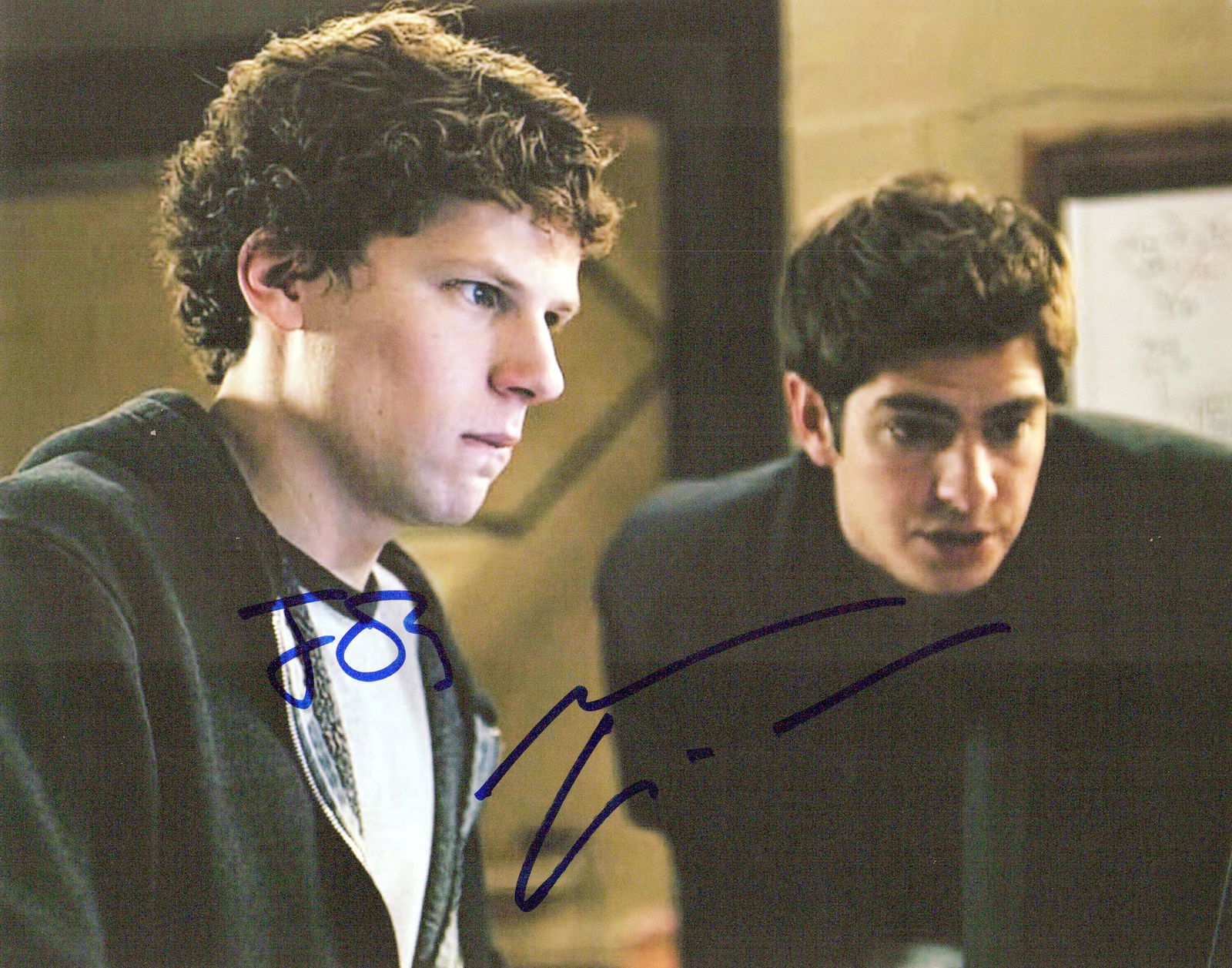 Jesse Eisenberg / Andrew Garfield SOCIAL NETWORK In Person Signed Photo: Photo size is 8x10. Jesse Eisenberg / Andrew Garfield in person signed photo from the movie THE SOCIAL NETWORK. Jesse Eisenberg as the character Mark Zuckerberg. Andrew Garfield as the character Eduar