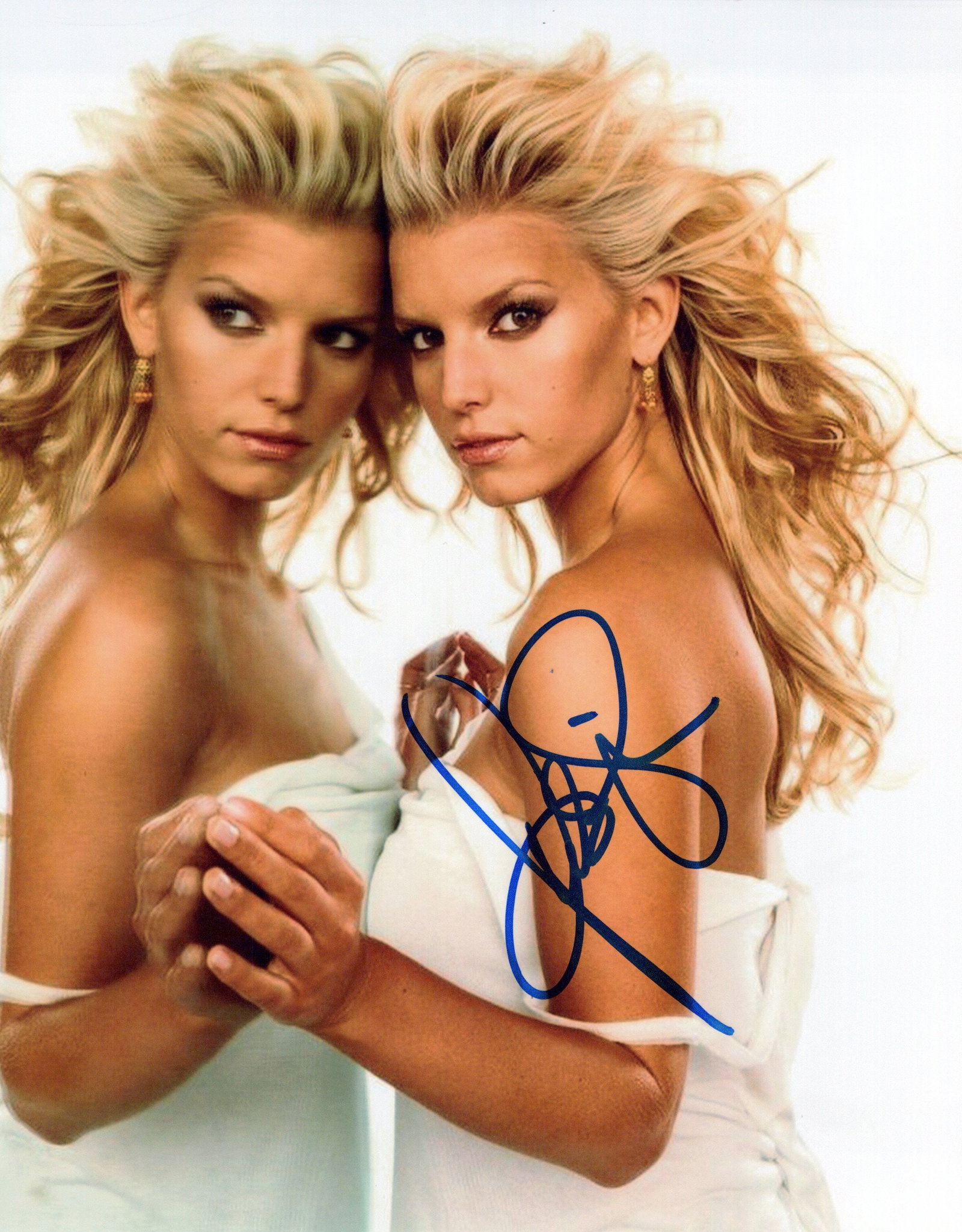 Jessica Simpson SEXY In Person Signed Photo: Photo size is 8x10. Jessica Simpson in person signed autographed photo. Jessica Simpson is an American singer, actress, fashion designer, and author. After performing in church choirs as a child, Simp