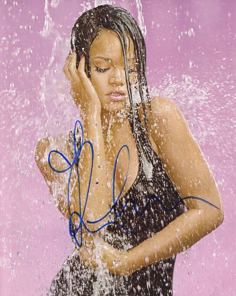 Rihanna SINGER In Person Signed Photo: Photo size is 8x10. Rihanna sexy in person signed autographed photo. Rihanna Fenty is a Barbadian singer, actress, and businesswoman. Born in Saint Michael and raised in Bridgetown, Barbados, Rihanna